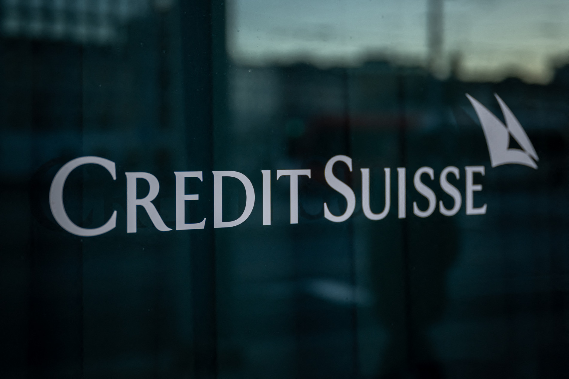  A sign of Credit Suisse bank is seen on a branch in Geneva, on March 15, 2023. (Photo by Fabrice COFFRINI / AFP)