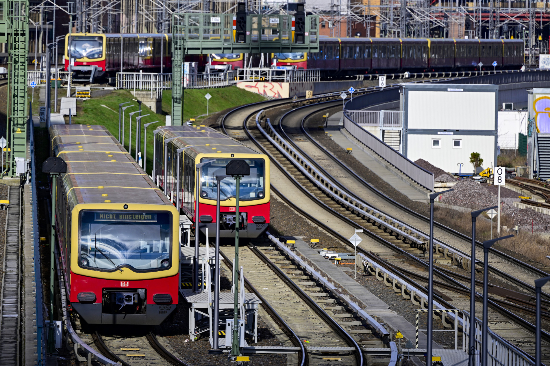  City trains sit idle on the tracks in east Berlin on March 27, 2023. - Germany's transport network was almost brought to a complete standstill on Monday as two of the country's largest unions went on strike.
Unions demanding higher wages to help their members cope with the rising cost of living
saw staff at airports, and public transport walk out after midnight for a 24-hour strike. (Photo by John MACDOUGALL / AFP)
      Caption