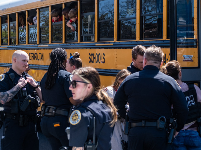  NASHVILLE, TN - MARCH 27: School buses with children arrive at Woodmont Baptist Church to be reunited with their families after a mass shooting at The Covenant School on March 27, 2023 in Nashville, Tennessee. According to initial reports, three students and three adults were killed by the shooter, a 28-year-old woman. The shooter was killed by police responding to the scene.   Seth Herald/Getty Images/AFP (Photo by Seth Herald / GETTY IMAGES NORTH AMERICA / Getty Images via AFP)