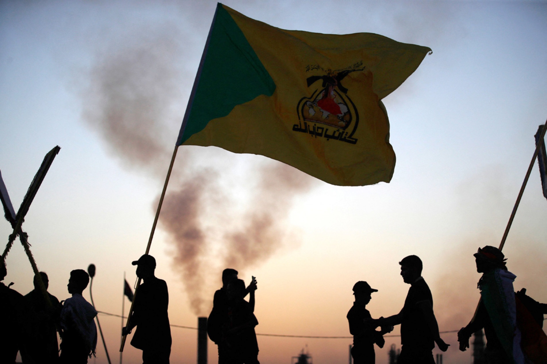  Shiite Muslims walk past an oil refinery near Baghdad on August 21, 2024, on their way to Karbala ahead of the Arbaeen commemorations that mark the end of the 40-day mourning period for the seventh century killing of the Prophet Mohamed's grandson Imam Hussein ibn Ali. (Photo by AHMAD AL-RUBAYE / AFP)
      Caption